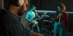 side-view-musicians-working-studio